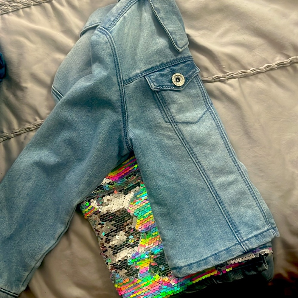 Adorable Jean jacket.new !!! With tags. Flip sequins back. rainbow/silver.